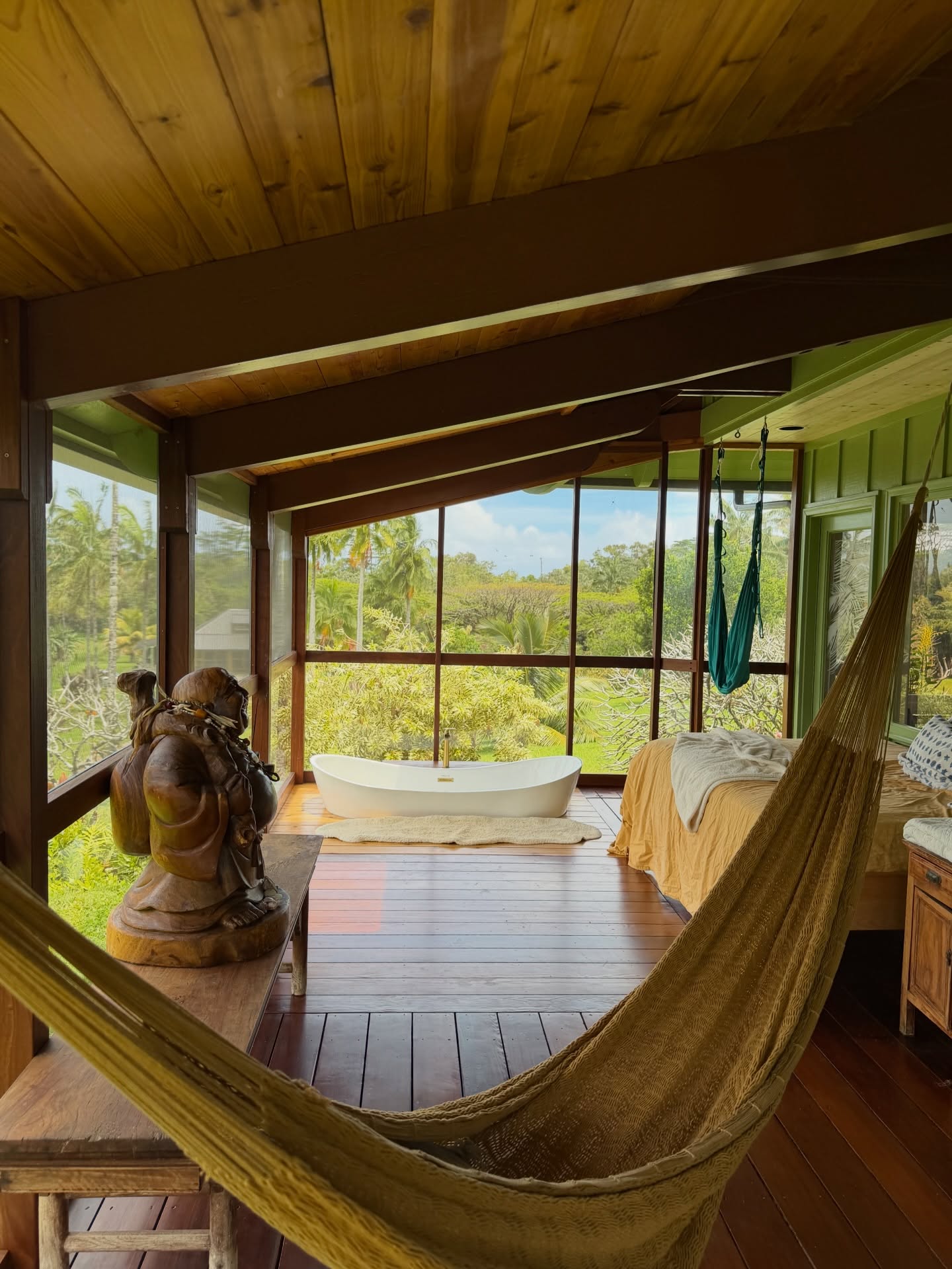 Dream lanai with hammock, soaking tub, and garden views