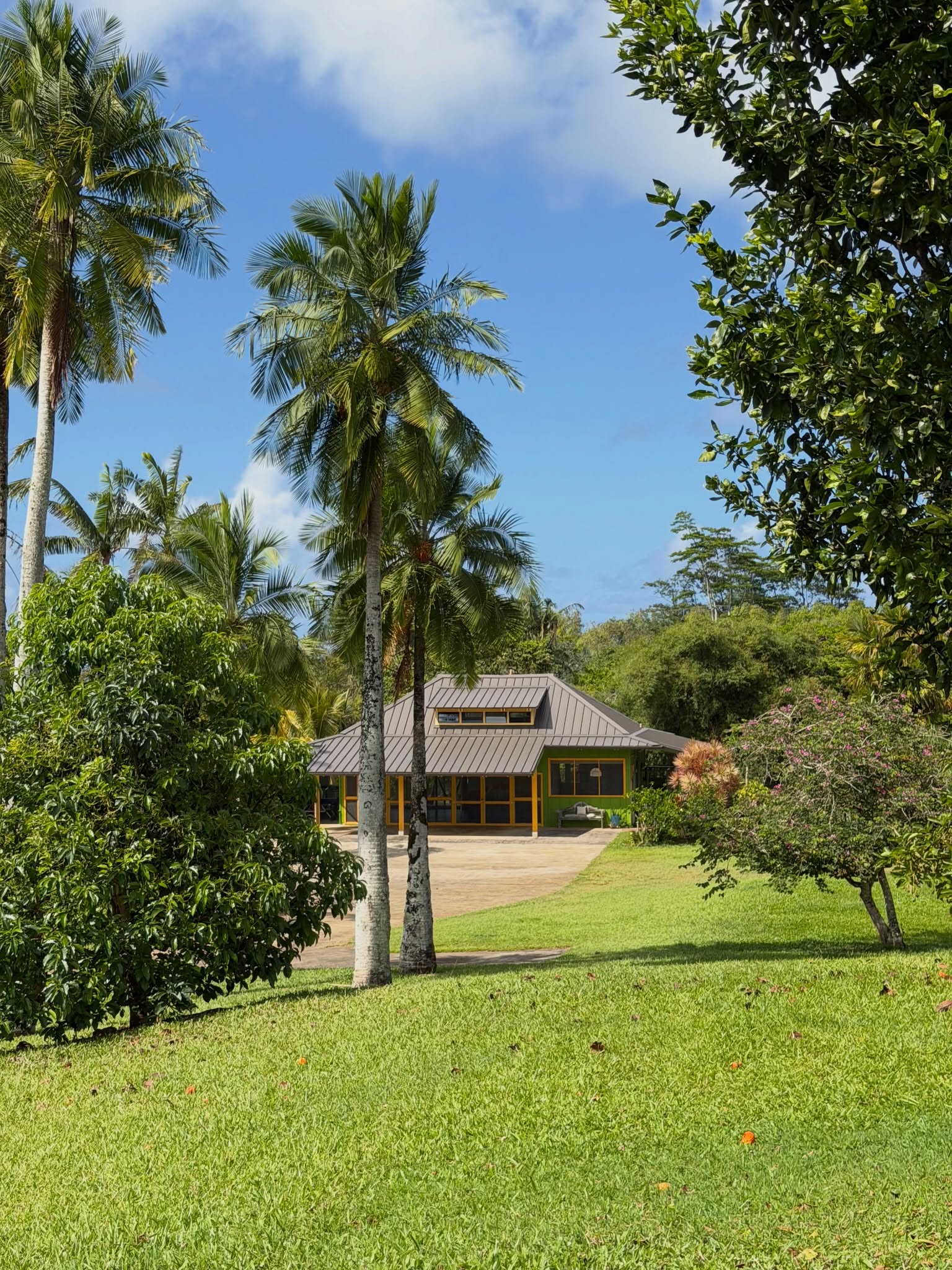 Cosmic Campus house beneath palms on Kauaʻi's North Shore